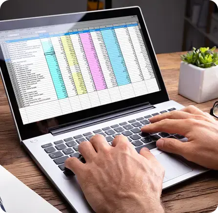 Professional working on a detailed spreadsheet to ensure audit-ready financial statements.