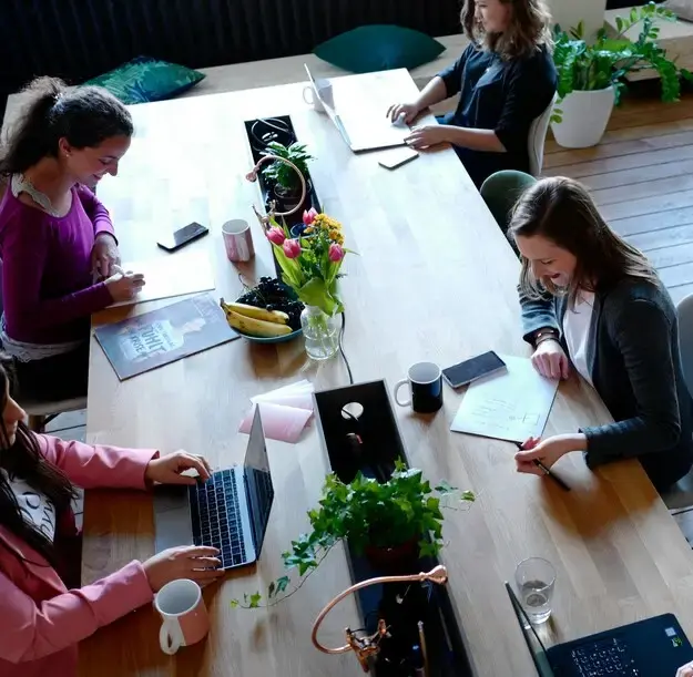 Creative agency team collaborating, supported by accurate resource planning and utilization data.