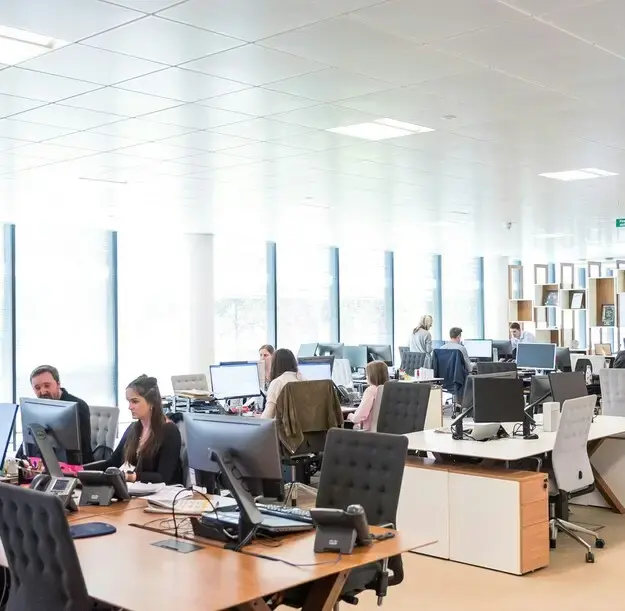 Growing corporate team working in a modern office, supported by strong financial infrastructure and tighter controls.