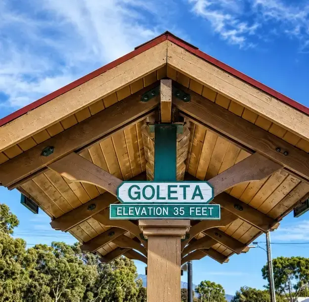 The Goleta Depot train station sign, confirming local financial services near this iconic landmark.