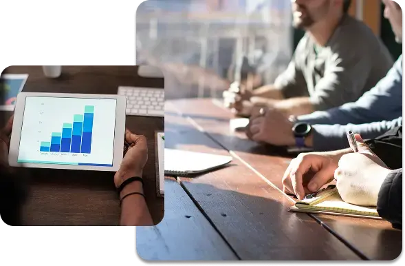 A team reviewing financial charts on a tablet to plan safe business growth and payroll modeling.