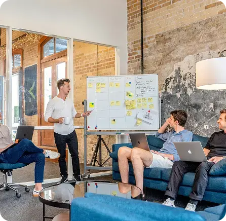 Modern office team designing growth strategies and payroll models for raises and bonuses.