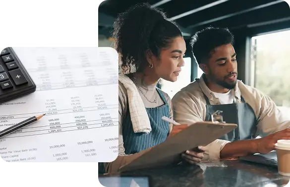 Small business owners reviewing paperwork and monthly account reconciliations to catch costly errors.