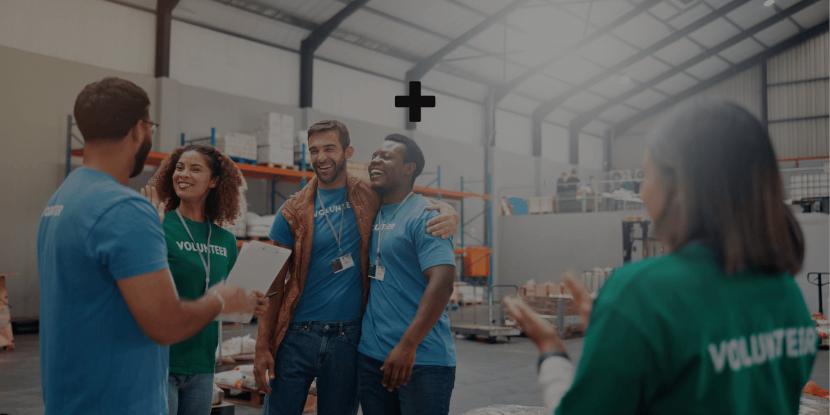 Nonprofit team members collaborating in a warehouse, representing the teamwork and financial clarity outsourced accounting brings to nonprofit organizations