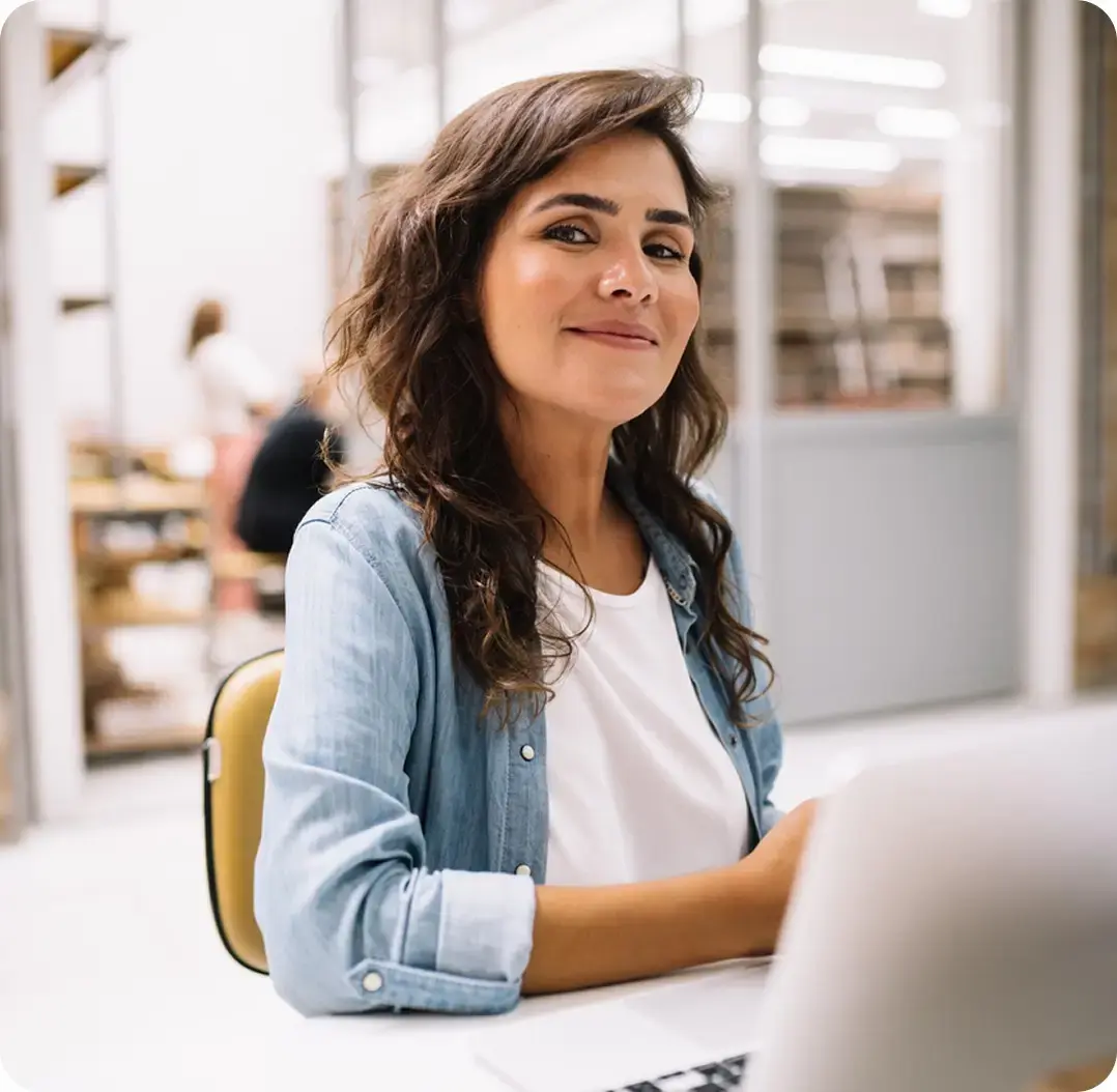 Business professional working on a laptop in a modern office