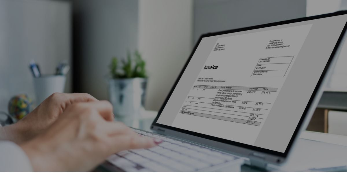 Laptop displaying a digital invoice, representing SaaS billing under California SB 122