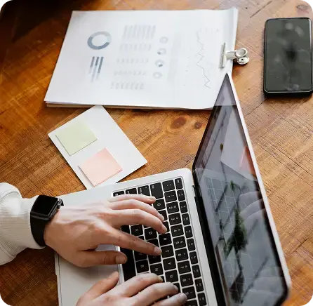 Accountant building scenario-tested models on a laptop for proactive business planning.